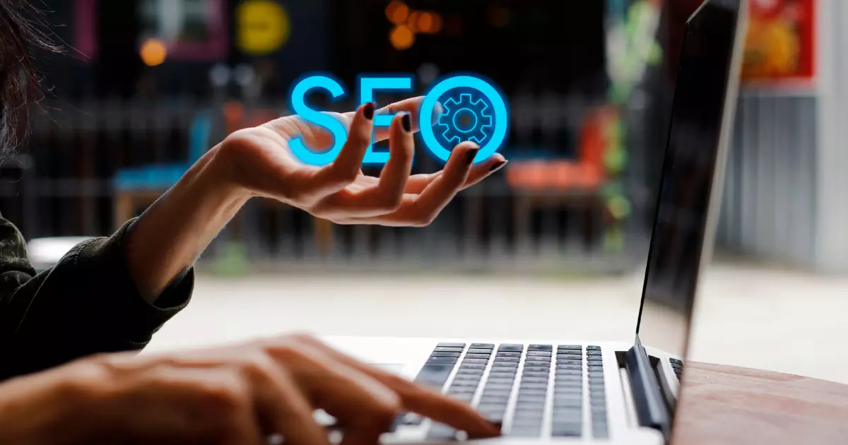 A hand holding a blue sign 'SEO'