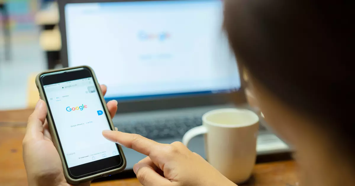 A person using a phone to search something on Google