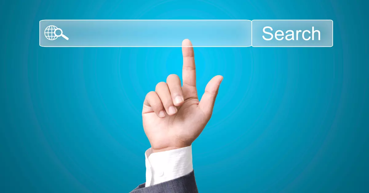 A hand touching a search button