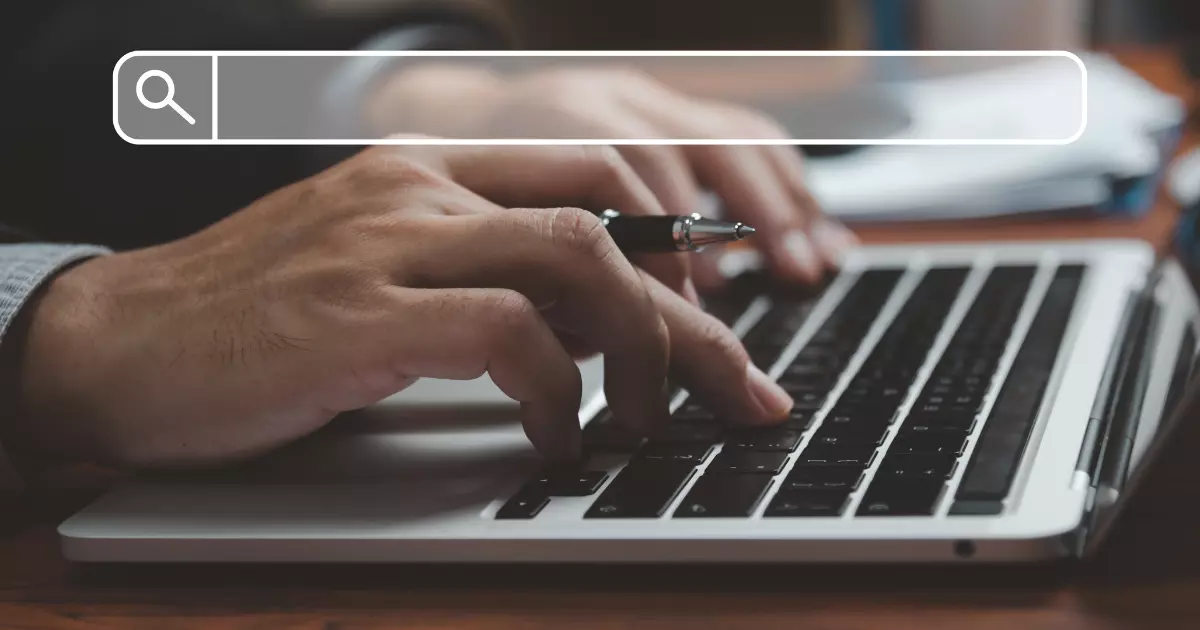 A person typing on a computer