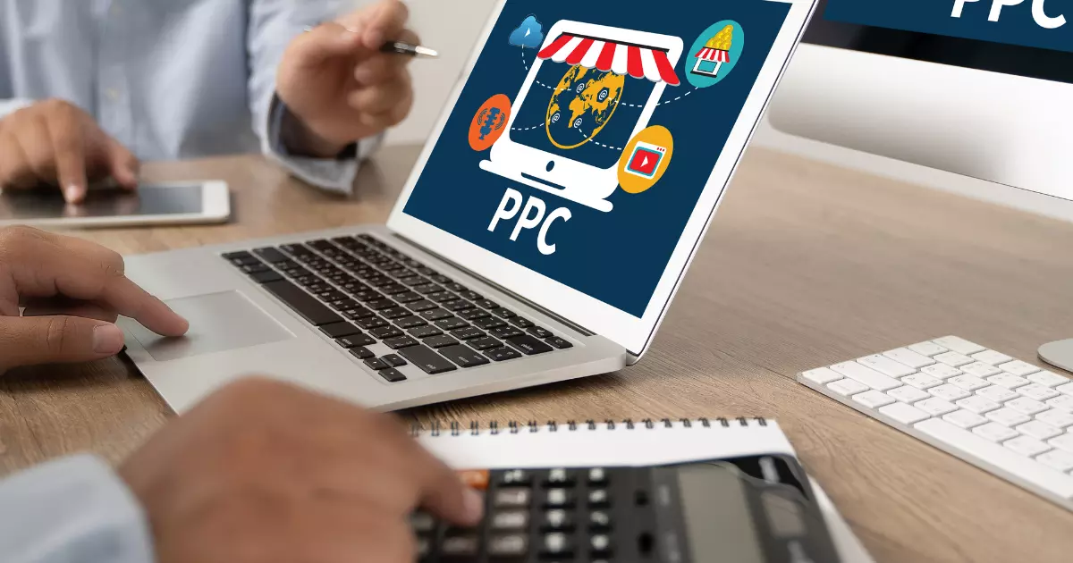 A person using a computer with PPC on screen