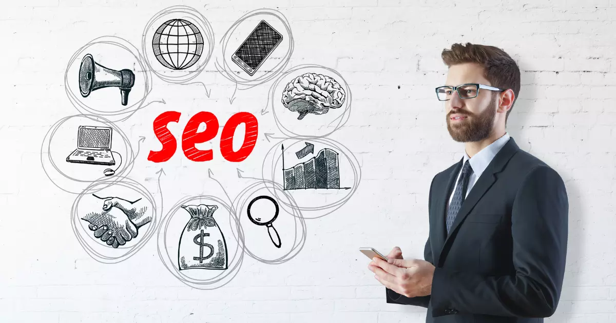A businessman in a suit holding a smartphone standing in front of a whiteboard with hand drawn SEO related icons representing the importance of search engine optimized content