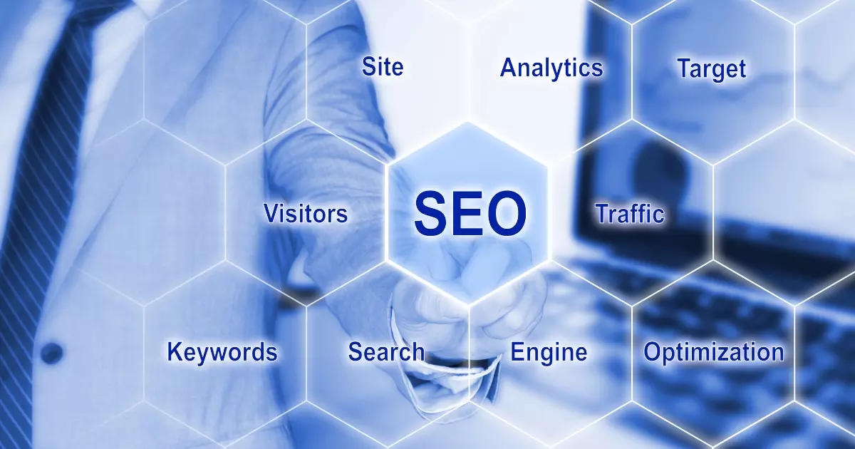 A businessman in a suit points at a digital interface displaying SEO and related terms like Keywords Traffic and Optimization representing the importance of long tail keywords