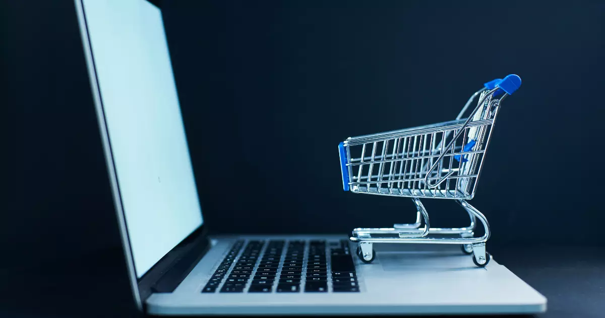 Mini cart on laptop symbolizing online marketplace 1